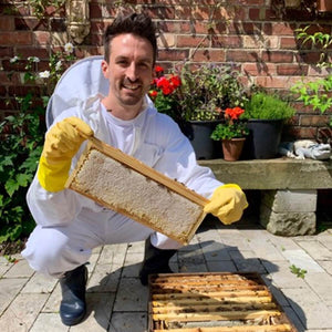 Joe from Just Bee with raw honey from beehives