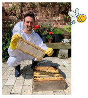 Joe from Just Bee Honey holding raw honey