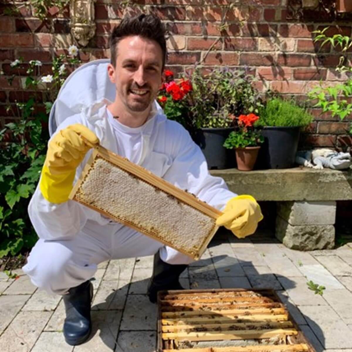 Joe from Just Bee with raw honey from beehives